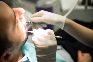 Man relaxed in the dental chair thanks to the sedation dentistry Las Colinas loves